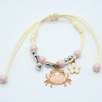 ADJUSTABLE BRACELET W/ BELL, CRAB & DAISY