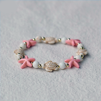 CREAM TURTLE & PINK STARFISH BRACELET