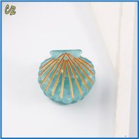 BLUE AND GOLD SHELL  HAIRCLIP