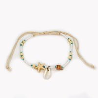 WHITE BEAD BRACELET WITH COWRIE SHELL AND SHELLS