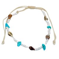 WHITE BEAD STRING ANKLET WITH SHELLS