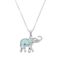 P8292 BLUE SYNTHETIC OPAL STAINLESS STEEL ELEPHANT PENDANT
